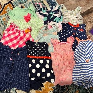 Lot of baby girl rompers size 6 months.